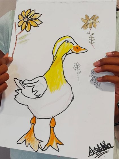 This artist chose a minimalist approach for her duck drawing, using simple outlines and selective color to make her subject stand out.
