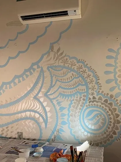 The mural in its early stages. Here you can see the base patterns being laid out before the finer details are added. The silver sheen is already starting to come through.