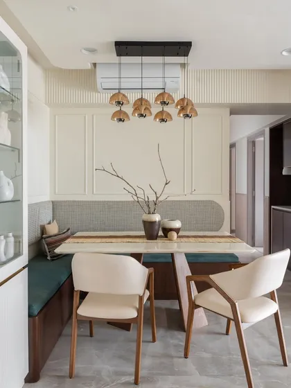 This cozy L-shaped dining bench in the 'Sukoon' home is more than just a place to eat. It’s a space for conversations and connection, designed to bring the family together.