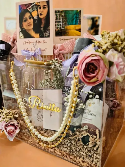 Asking friends to be your bridesmaids is a special moment. I designed this personalized acrylic hamper with a custom coffee tumbler, wine, pamper items, and even personal photos to make the proposal unforgettable.