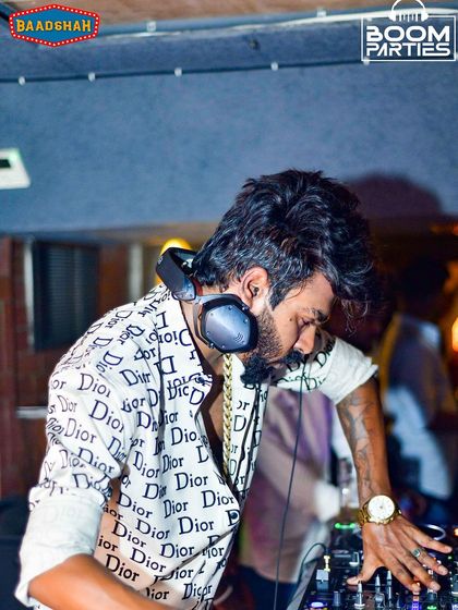 Deep in concentration, cueing up a track at Baadshah, Bangalore.