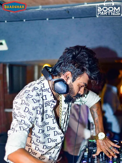 Deep in concentration, cueing up a track at Baadshah, Bangalore.