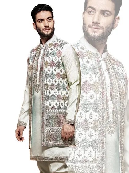 This off-white sherwani features a unique, multi-colored geometric embroidery on the jacket. It is a contemporary piece for the man who appreciates artistry and modern design.