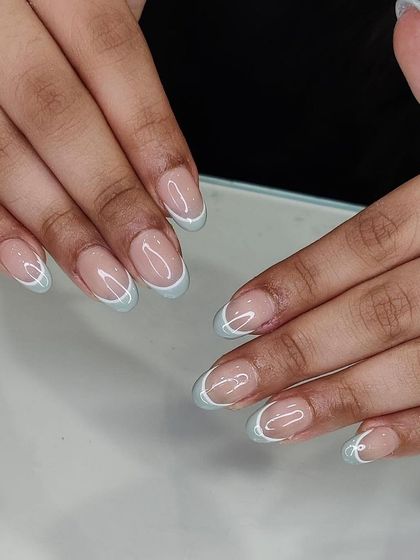 This full set shows the clean application of the baby blue French manicure. It's a perfect example of a simple design executed with precision.
