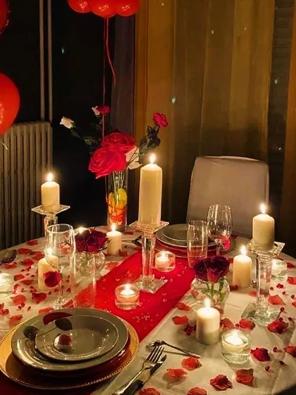 We curate romantic, luxe dinners for special occasions. This intimate table for two is set with candles, rose petals, and fine dinnerware, creating the perfect ambiance for a date night or anniversary.