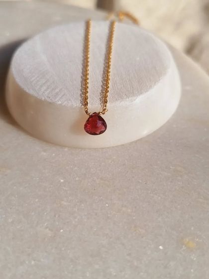 Another view of the 'ṣatra' Pink Tourmaline heart drop pendant. Its deep pink hue is perfect for anyone looking to invite more love and compassion into their life.