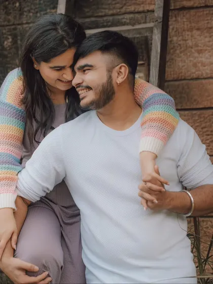 A happy, relaxed moment between a couple during their pre-wedding session. We aim to capture the smiles and easy comfort you share, creating photos that feel authentic and full of love.