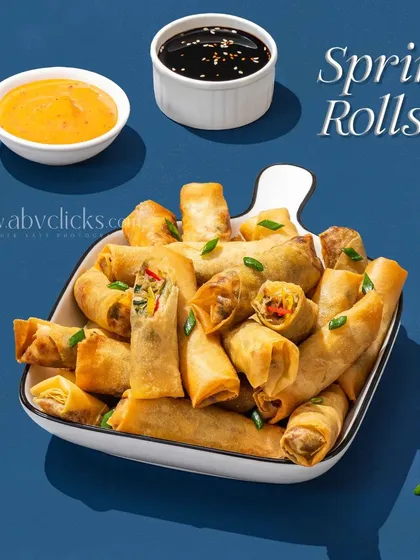 A platter of mini spring rolls, shot for a "Better with Pepsi" campaign.