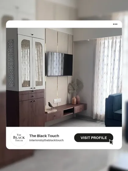 A promotional image showcasing our work on a modern living room. The caption "Home is where color invites you, cozy corners hug you" perfectly captures our design philosophy.