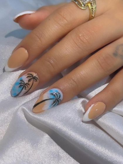 Another look at the Goa-themed nails, perfect for a beach getaway. The combination of nail art and French tips makes this set fun yet stylish.