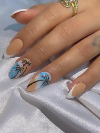 Another look at the Goa-themed nails, perfect for a beach getaway. The combination of nail art and French tips makes this set fun yet stylish.