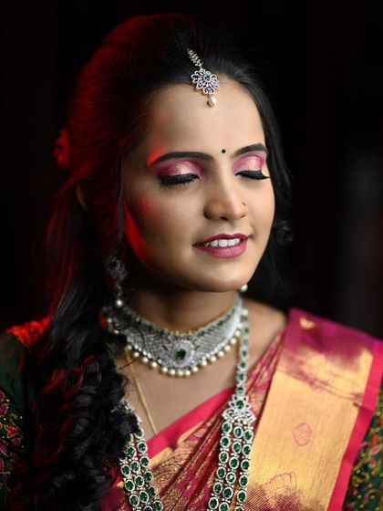Disha's reception look, with a focus on her dramatic pink smokey eye and beautiful diamond and emerald jewellery.