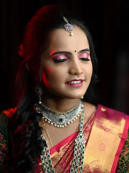 Disha's reception look, with a focus on her dramatic pink smokey eye and beautiful diamond and emerald jewellery.