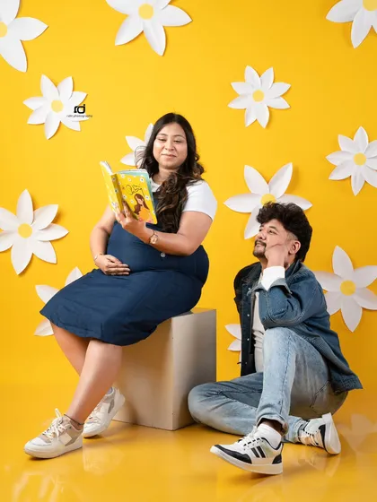 Reading a story to the baby bump. This is a sweet and creative way to show the couple bonding with their baby even before arrival.