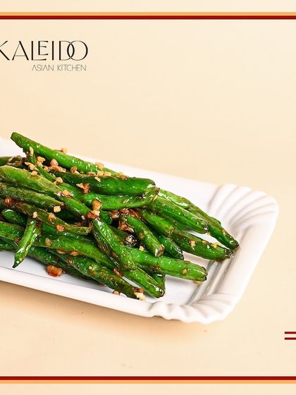 Who says veggies can't be delicious? These wok-tossed green beans are flash-fried and seasoned with garlic and spices, making for a simple, crunchy, and addictive side dish.