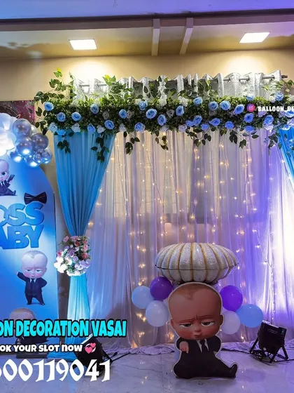 A fun and playful "Boss Baby" themed naming ceremony. The blue and white decor, complete with character cutouts and a custom backdrop, is perfect for celebrating your new little boss.