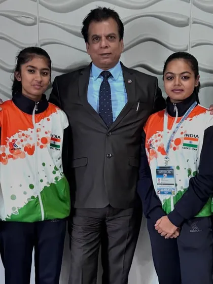 With a group of our junior female athletes at the Commonwealth Championship. These young champions represent the growing strength of women's karate in India.