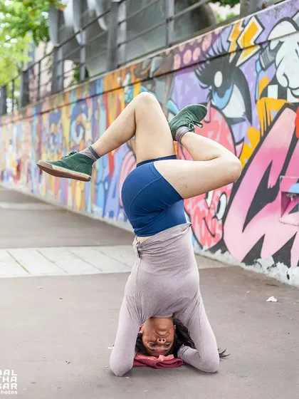 A variation of Sirsasana (Headstand) with legs in Padmasana (Lotus Pose). This advanced inversion challenges balance and concentration while combining the benefits of both postures.