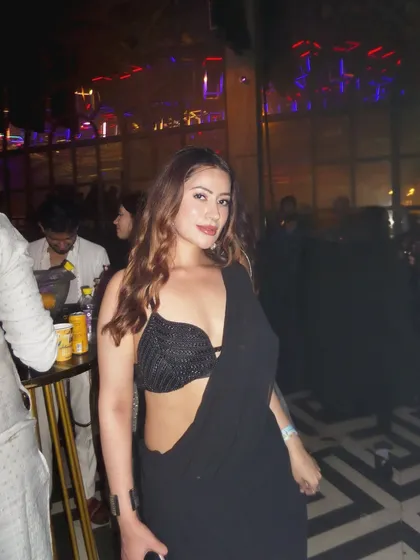 A front-facing view of the party saree look, showing how to make ethnic wear club-appropriate.