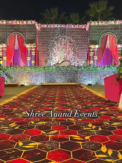 A head-on view of the magnificent stage, showcasing its detailed architecture and the beautiful floral arrangements at its base.