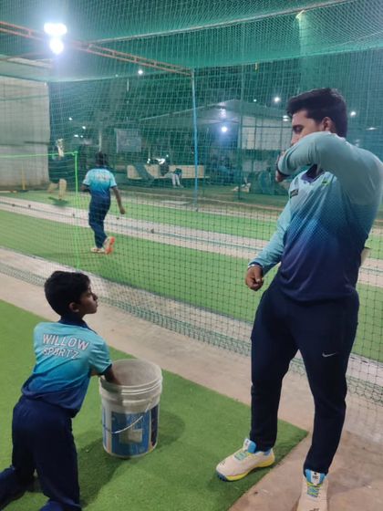 A night session under lights. We offer flexible training times, including evening batches, so players can practice without compromising on their schoolwork.