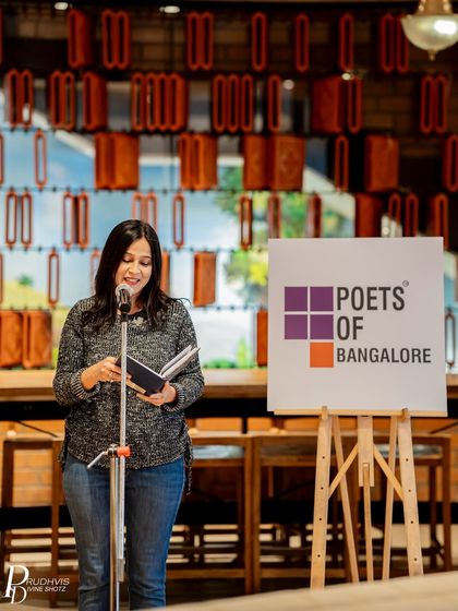 A poet reads from her book during the "Wheel of Life" event. It was a relaxed Sunday immersed in creativity.