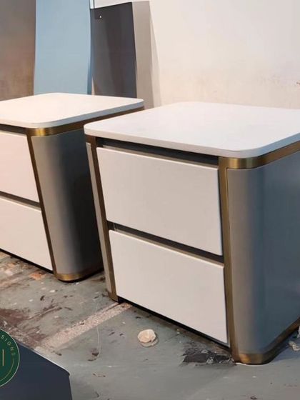 Another view of the white and gold nightstands, highlighting their sleek, contemporary design and quality construction.