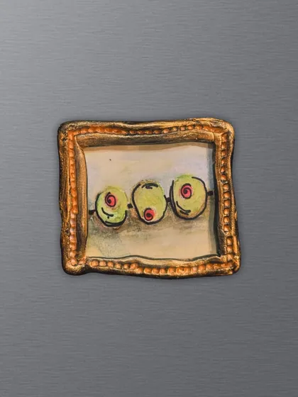 Three olives on a skewer, captured on a tiny canvas. This retro-style magnet is a fun piece for anyone who appreciates a quirky, food-inspired aesthetic.