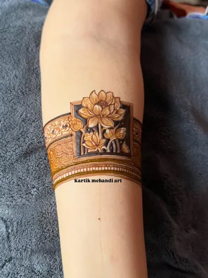 A modern and chic arm band design featuring a beautifully shaded lotus flower. This minimalist style makes a sophisticated statement.