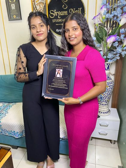 A happy student receives her certificate. Our goal is to make you a confident and skilled nail artist.