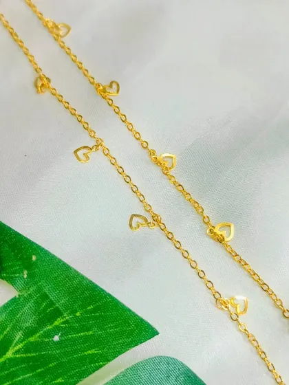 Our tiny heart-link chain is a delicate and charming option for necklaces and bracelets. It's perfect for creating romantic and minimalist jewelry pieces.