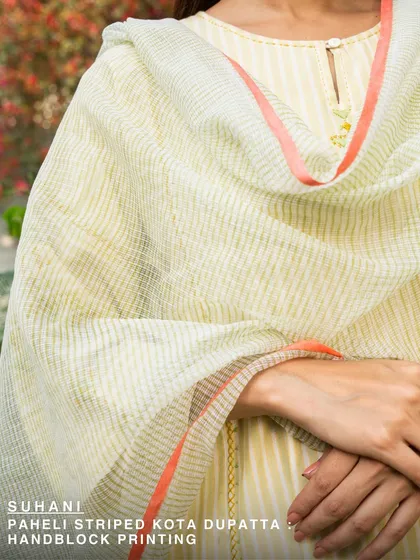 Our Suhani Paheli striped Kota dupatta features a subtle blend of colors, hand-block printed on light cotton. It’s a testament to the quiet details that make our pieces special.