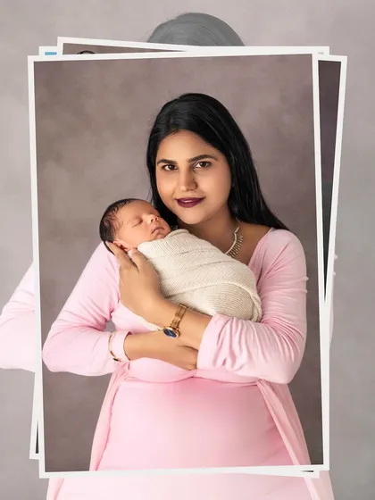 A proud new mother holding her baby. These first portraits together are so incredibly special and become more precious with each passing year.