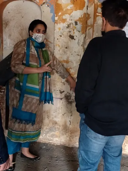 On-site discussion during the haveli restoration, where I collaborate closely with the team to resolve details and ensure the authenticity of the work.
