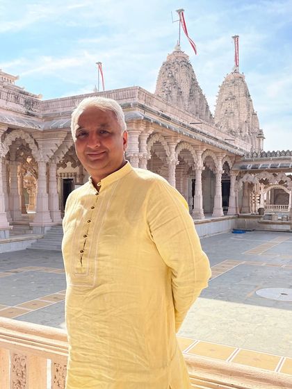 Another shot of our client in his sustainable hemp kurta, enjoying a moment at a temple. This durable and eco-friendly fabric is perfect for both special occasions and everyday wear.