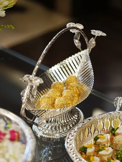 Complete your festive decor with my serveware collection. This leaf-shaped basket with a floral handle is perfect for serving sweets and adding a touch of nature-inspired elegance.