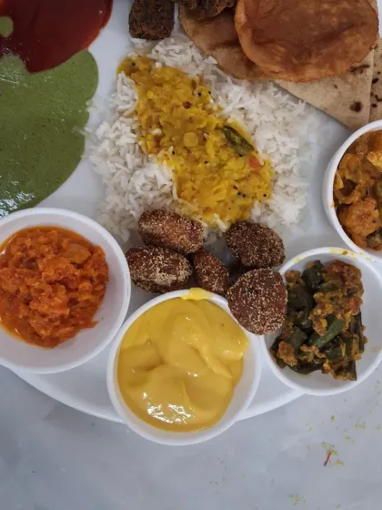 Another example of a delicious and colourful meal plate from a wedding in Airoli. It features a mix of traditional Maharashtrian and North Indian dishes.
