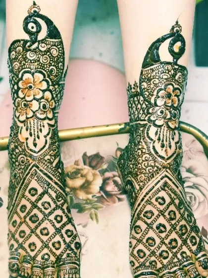 The bridal mehendi isn't complete without the feet. This shot captures the beautiful peacock and floral designs on the bride's feet.