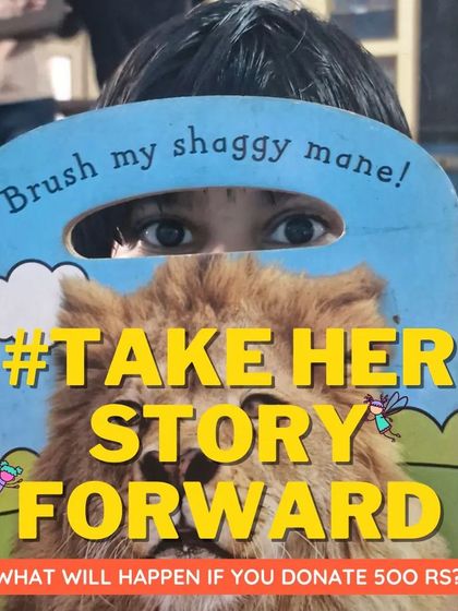 A child peeks through a touch-and-feel book. Interactive and sensory books are a wonderful way to engage our youngest readers and make reading a multi-sensory experience.