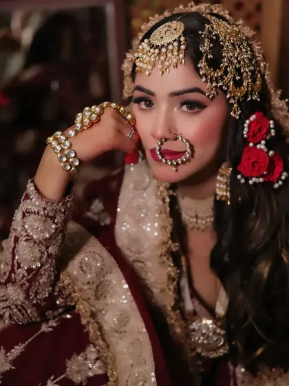 We stay updated with the latest trends to give you photos that are both timeless and fashionable. This portrait, inspired by the popular "Heeramandi" look, features rich colors, traditional jewellery, and a regal pose.