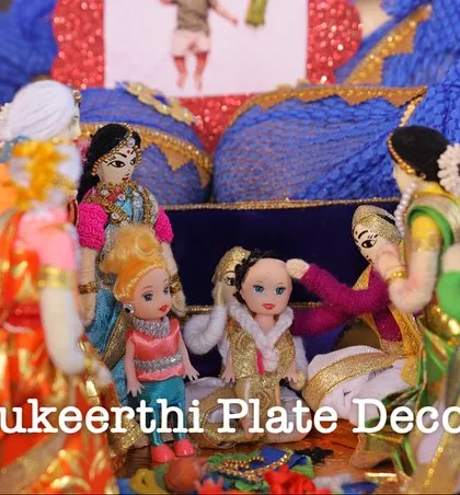 A detailed look at my thematic dolls depicting an ear piercing ceremony, with family members gathered around the child. It's these little details that make an event memorable.