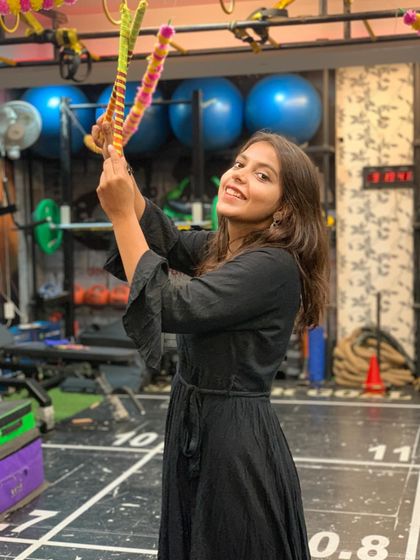 A happy member posing with dandiya sticks during our Garba celebration. It's all about having fun and enjoying the festive spirit.