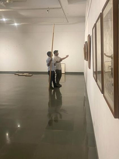 A long shot of the gallery during the installation of 'Bring me Flowers', showing the empty space beginning to take shape.