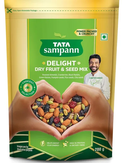 Another packaging simulation for Tata Sampann, this time for their Dry Fruit & Seed Mix. The heart-shaped hands concept is repeated to maintain brand consistency across the product line, showcasing the colorful and delicious mix inside.