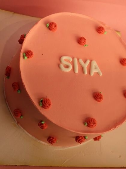 The top-down view of the pretty pink naming ceremony cake.