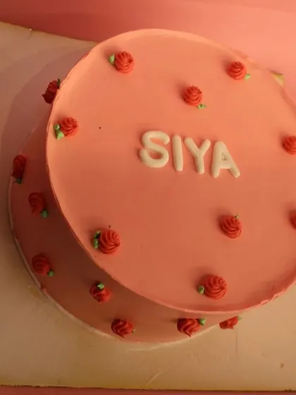 The top-down view of the pretty pink naming ceremony cake.