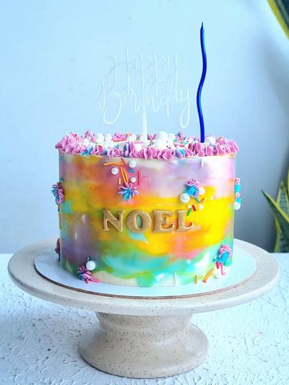 A watercolor-style buttercream cake. I show you how to blend different colors smoothly on the side of the cake to create this beautiful, soft-focus effect.