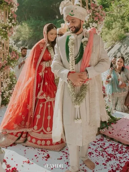 A candid shot from a breathtaking destination wedding in Rishikesh. The bride's soft and effortless makeup allowed her natural joy to shine through against the divine backdrop of the Ganga.