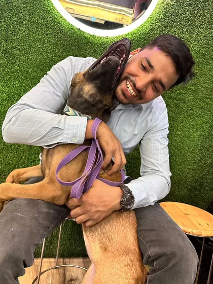 There's nothing better than a playful moment with a happy dog. This is Cacy, full of life and affection.