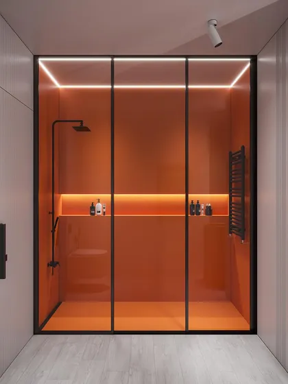 A 3D visualization of a modern bathroom concept featuring a bold, orange back-painted glass shower enclosure. The design uses integrated LED strip lighting to create a dramatic, ambient glow and highlight the clean lines.